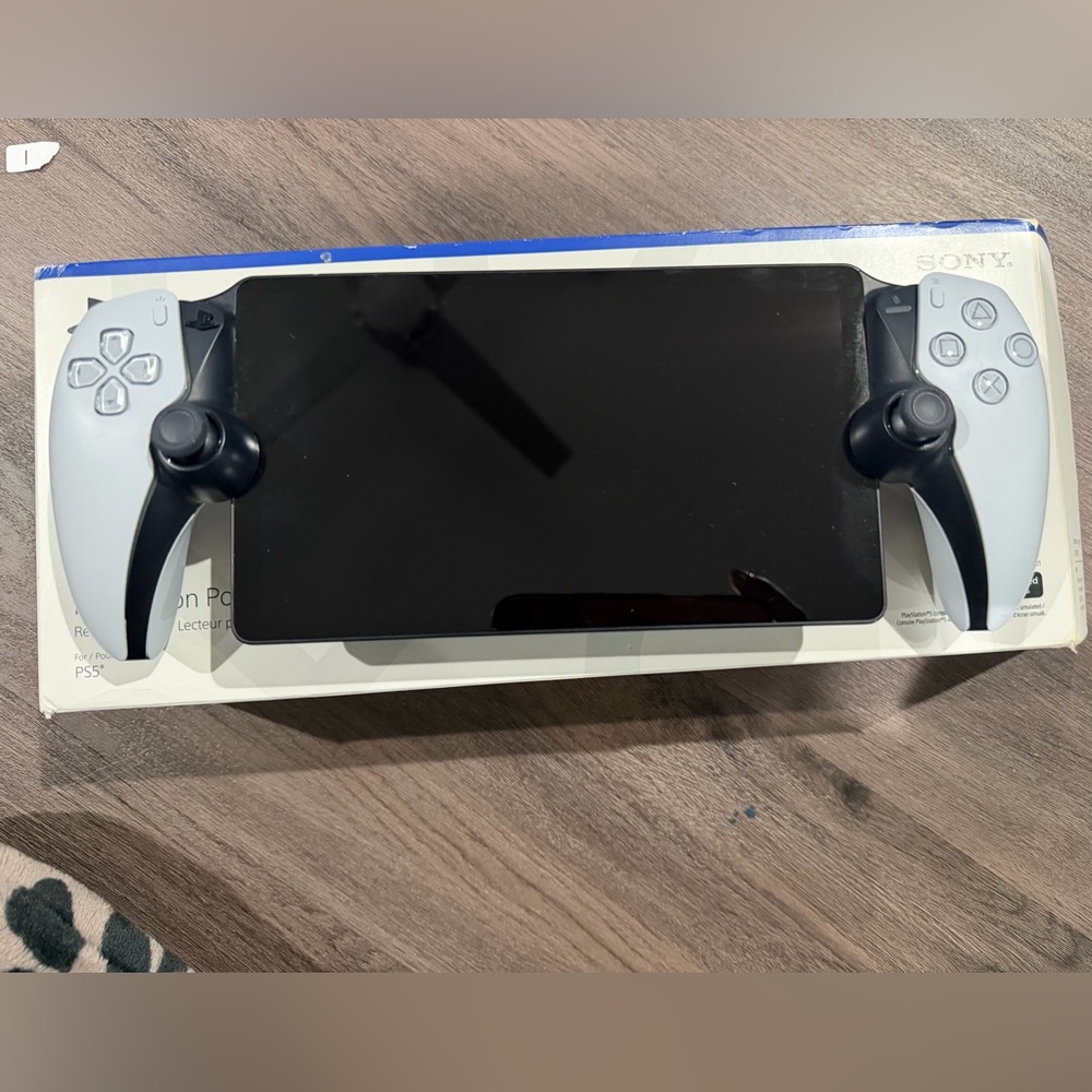Sony Handheld Console with Black and Gray Design